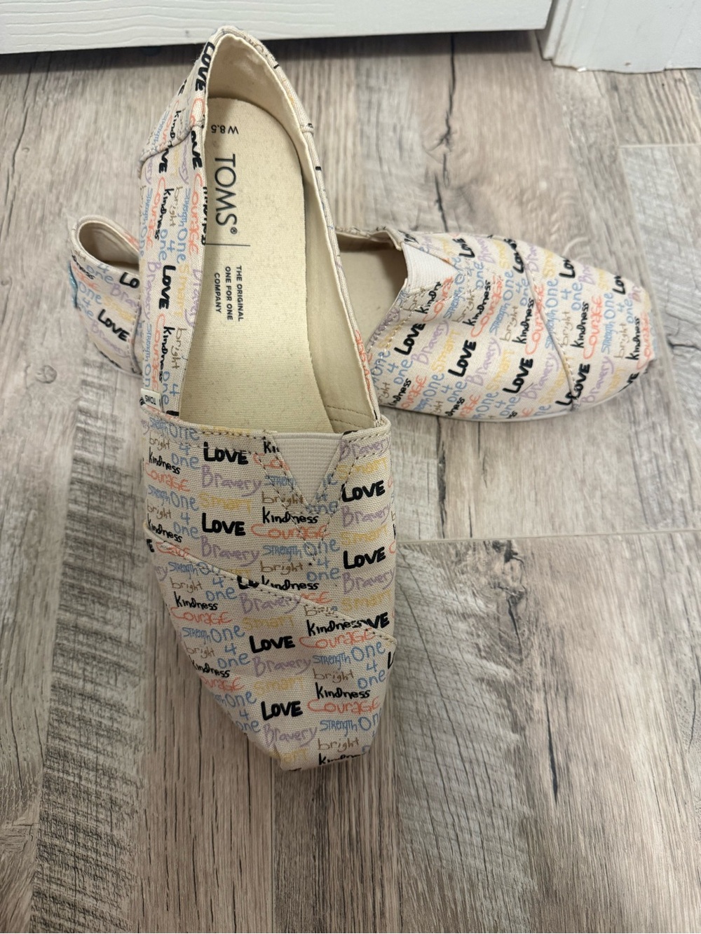 Toms Women's Cream Canvas Slip-On Flats with Multicolor Script - Picture 1 of 3